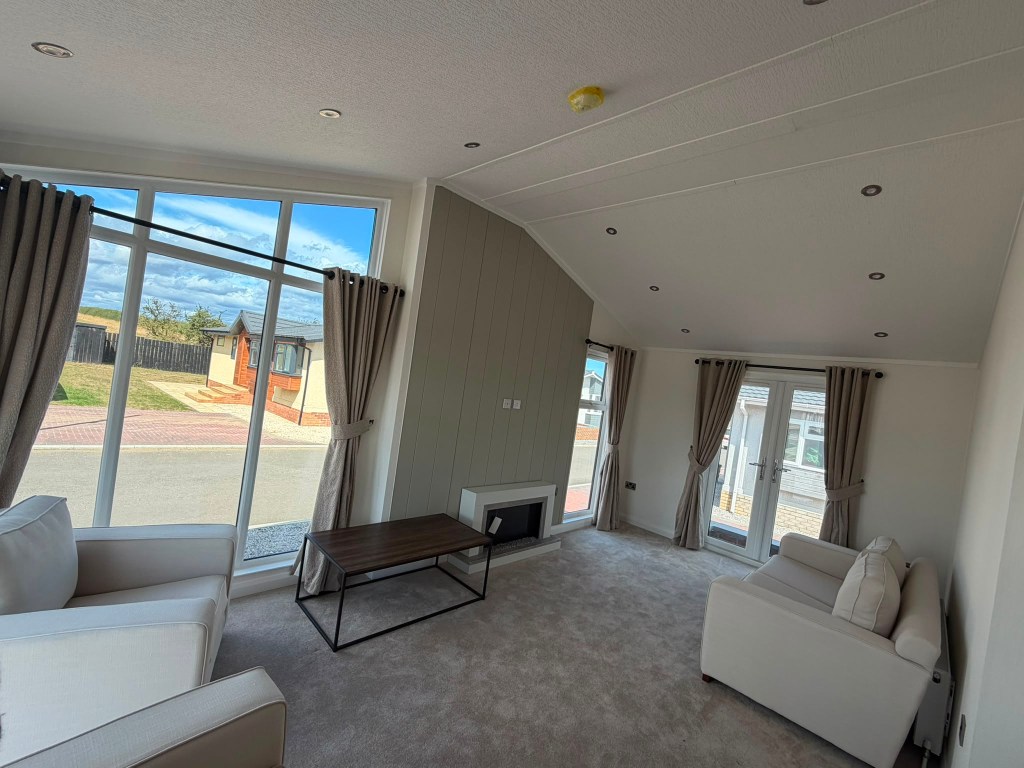 Luxury bathroom with freestanding roll-top bath — Stately Wentwood residential lodge